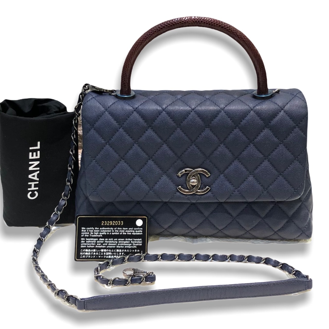 Used in good condition ! Chanel Coco 10.5” Navy caviar with red lizard handle Rhw Holo 23